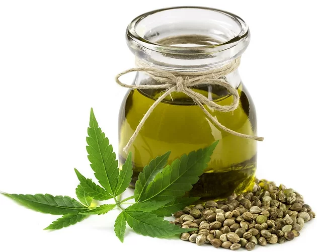 Flask of Hemp Oil with hemp seeds at the base